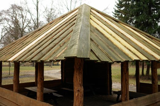 Traditional wooden picnic hiking rest place shelter in nature