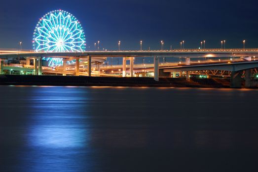 ferris wheel over night water, Tokyo
