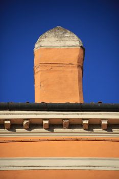 Yellow chimney on the roof