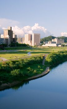 It is a cityscape photo of house near a river.