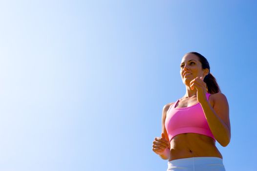 Athletic woman working out in a meadow, from a complete series of photos.