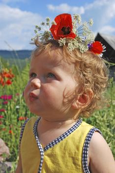 small girl with floral wreath