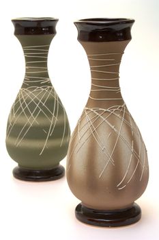 two decorate ceramic vase on the white background
