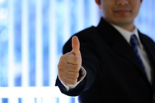 Businessman with his thumb up