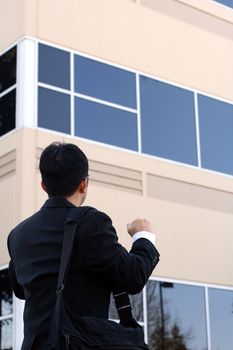 Businessman with fist up, happy and successful symbol