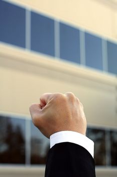 Fist of a businessman, showing happiness and excitement