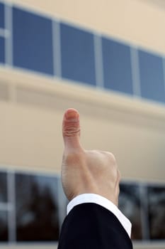 A happy businessman with the thumb up