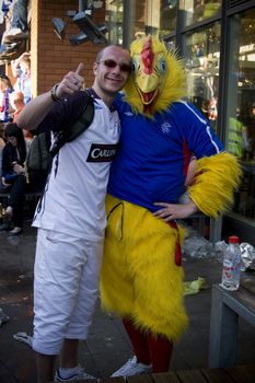 Football chicken mascotte for the UEFA football cup with the Glasgow rangers against St Petersburg,zenit  Piccadilly gardens, Manchester,uk