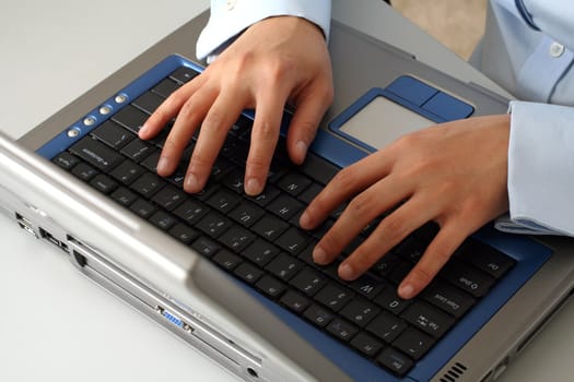 Businesswoman hands on laptop