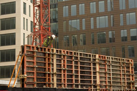 Worker on a construction site in town