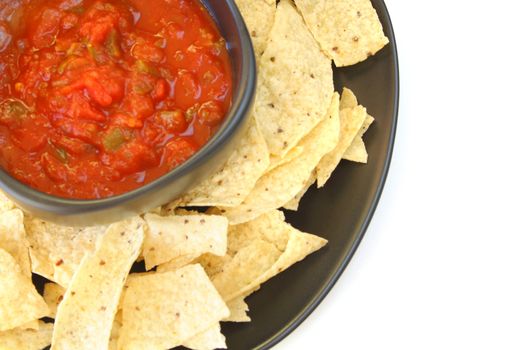 Salsa and chips isolated on a white background.