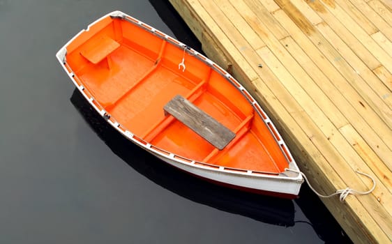 row boat tied to dock


