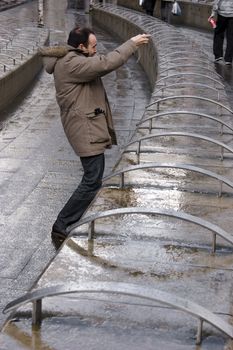 Man taking a picture in a strange posture