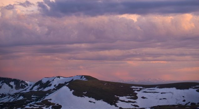 Colorado sunset from the high alpine tundra of Trail Ridge looking out to the distant Gore Range