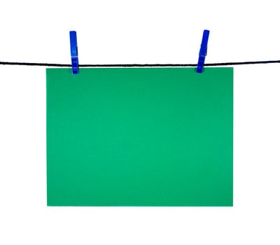green blank sheet on clothes-line for your notice, isolated on white
