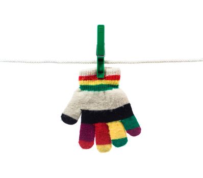 multi colour kid glove on clothes line isolated on white