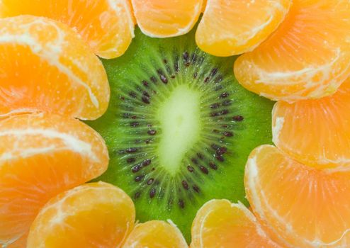 close-up kiwi and tangerine slices as flower