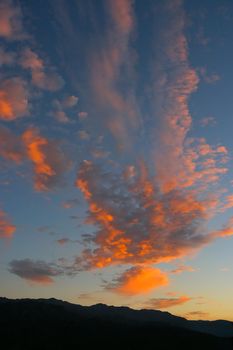 Beautiful sunrise with fire red clouds.