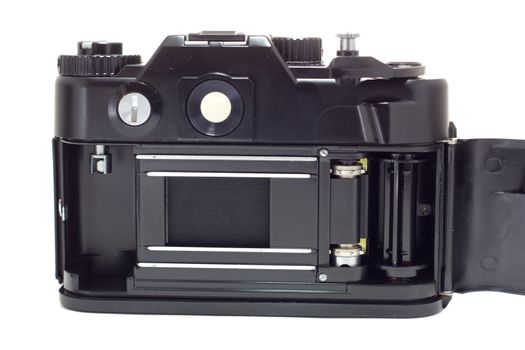 Old reflex camera with open cover, rear-view, isolated on white