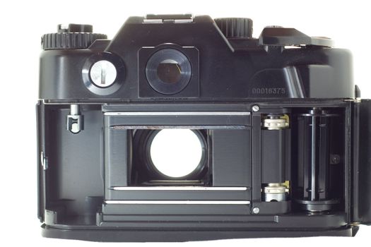 Old reflex camera with open  shutter, rear-view, isolated on white