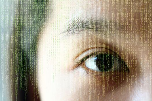 A woman's eye, showing reflection of random letters