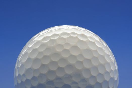 Golf ball on blue background