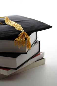 Graduation cap and textbooks