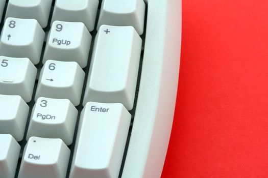 Computer keyboard on red