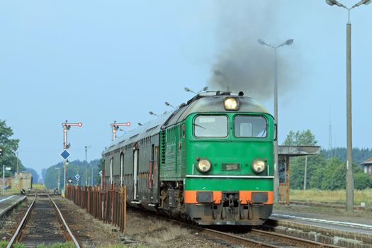 Passenger train starting from the station
