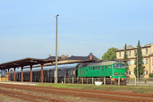 Passenger train waiting at the station platform
