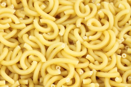 Yellow noodles close up as background