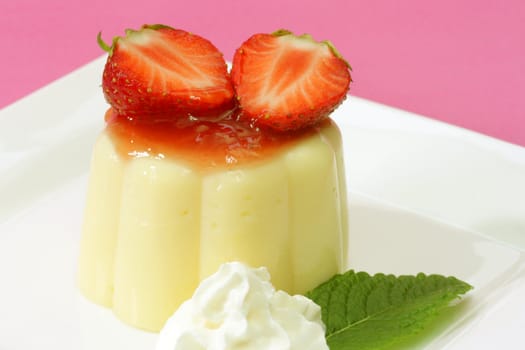 Delicious vanilla custard with fresh strawberries in detail-.