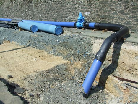 Water pipe construction being laid. Shot in Germany 