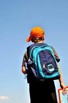 Boy goes to school learning at the beginning of school year

