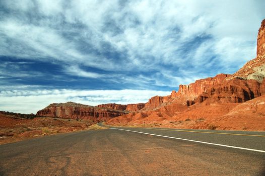 An endless roadway through the deserted Capitol Reef national park at Utah taken during early winter