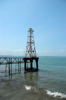 A lone lighthouse on a deserted beach