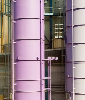 Pink tanks for storage of liquid chemicals.
