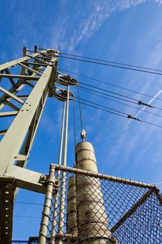 Overhead contact wires of electrified railway tracks kept under tension.