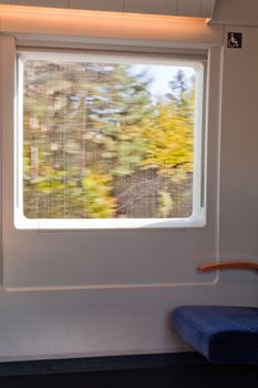 Interior view through window of high-speed train.