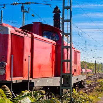 Shunting engine parked outside on switching yard.