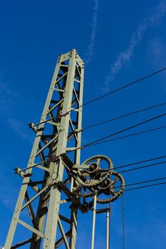 Overhead contact wires of electrified railway tracks kept under tension.