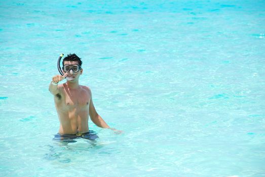 man excited with thumbs up for snorkeling adventure in Maldives
