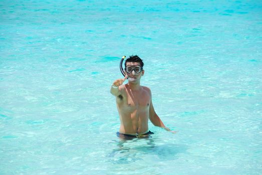 man excited with thumbs up for snorkeling adventure in Maldives