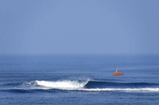 A self fish man on an orange boat