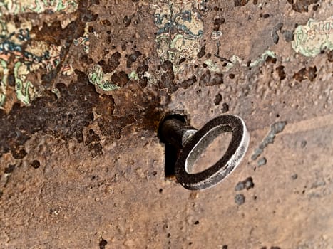 background old brown rusty keyhole with key 