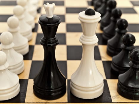 photo of the chessboard with black and white pawns on it