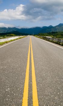 It is a cloudscape of clouds over the road.