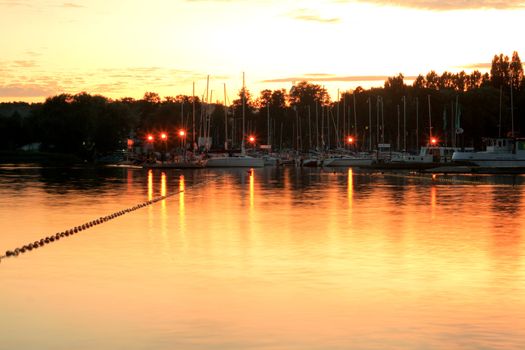Lake and a marina during the sunset
