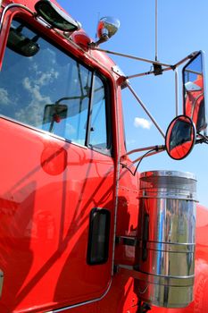 Cab of a red big rig truck
