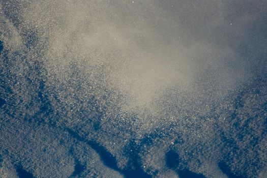 Cloud of powdery snow of approaching avalanche.